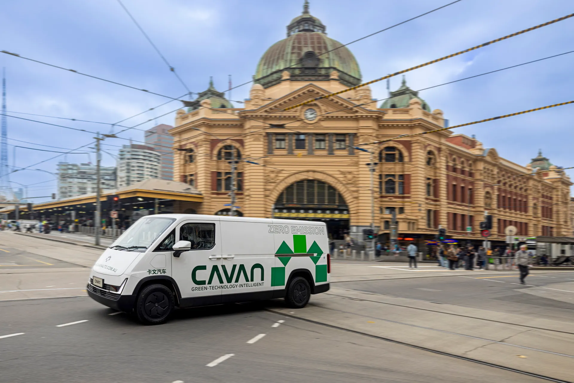 A Cavan electric van passing Flinders Street Station in central Melbourne