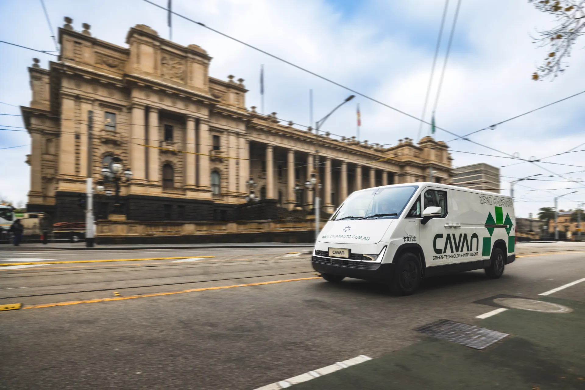 A Cavan electric van driving past Parliament House in Melbourne