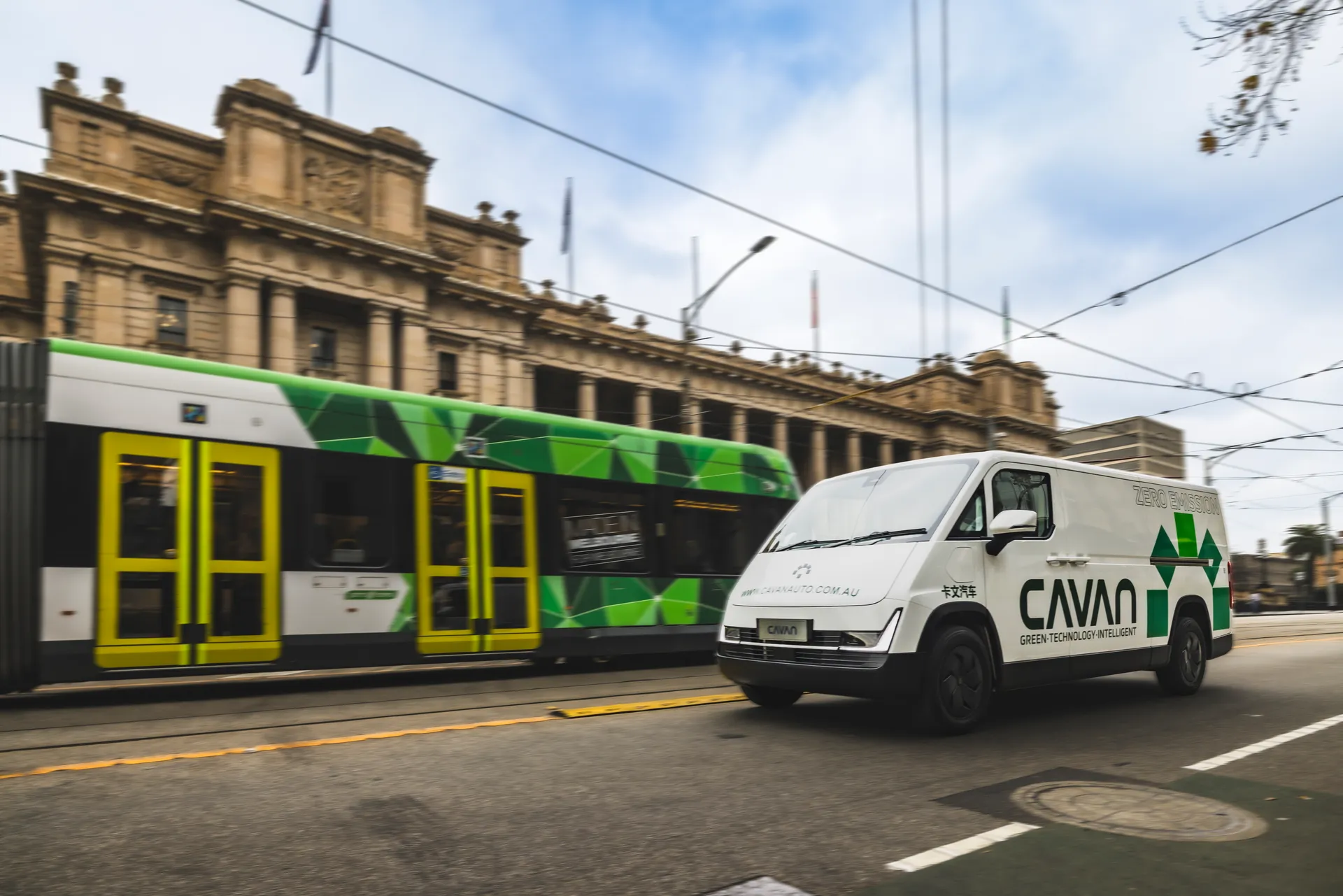 A Cavan electric van alongside a Melbourne tram outside Parliament House