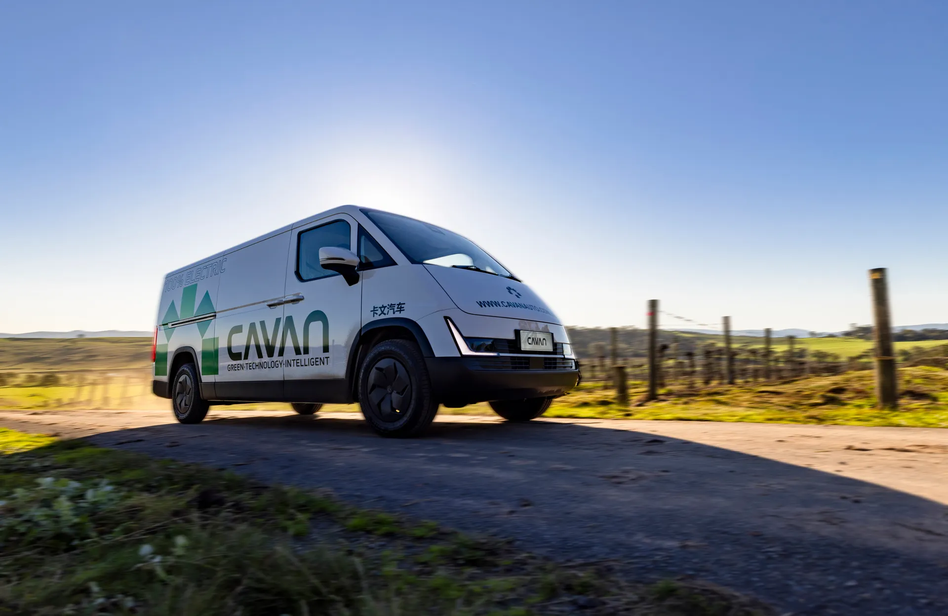 Front view of a Cavan electric van on a gravel road in early morning light